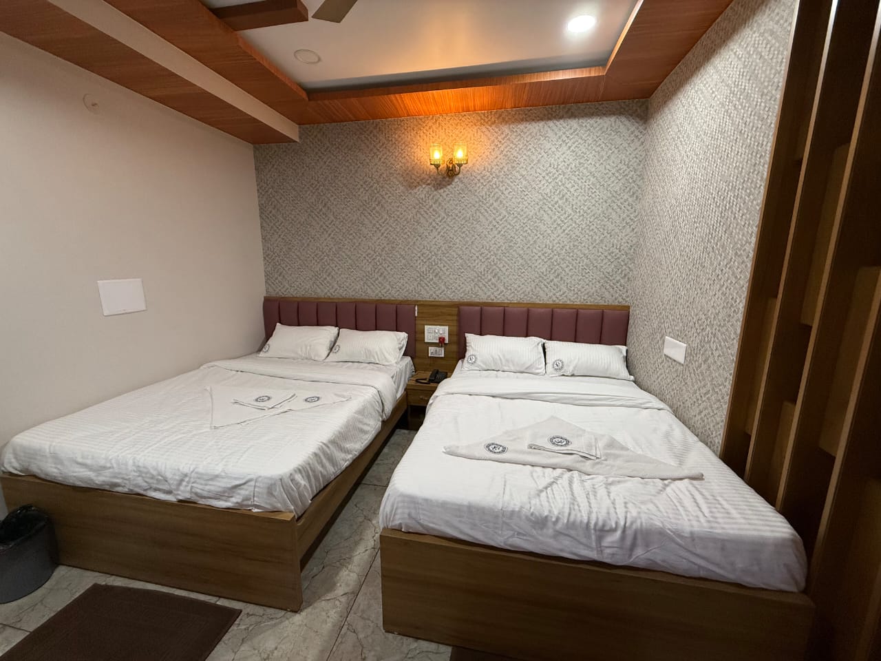 Neat and hygienic guest room in Dharwad lodge
